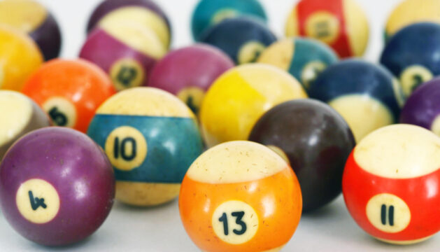 Color photo of old billiard balls on white background