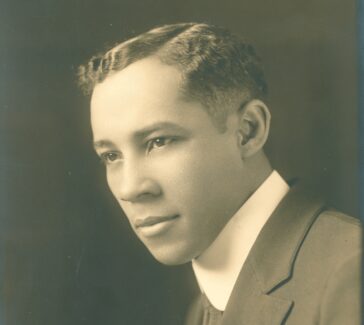 Professional portrait of E. M. A. Chandler, ca. 1930. He looks over his left shoulder and is wearing a suit.